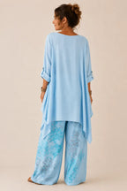 Fiorella | Conjunto floral de blusa asimétrica y pantalón de pierna ancha